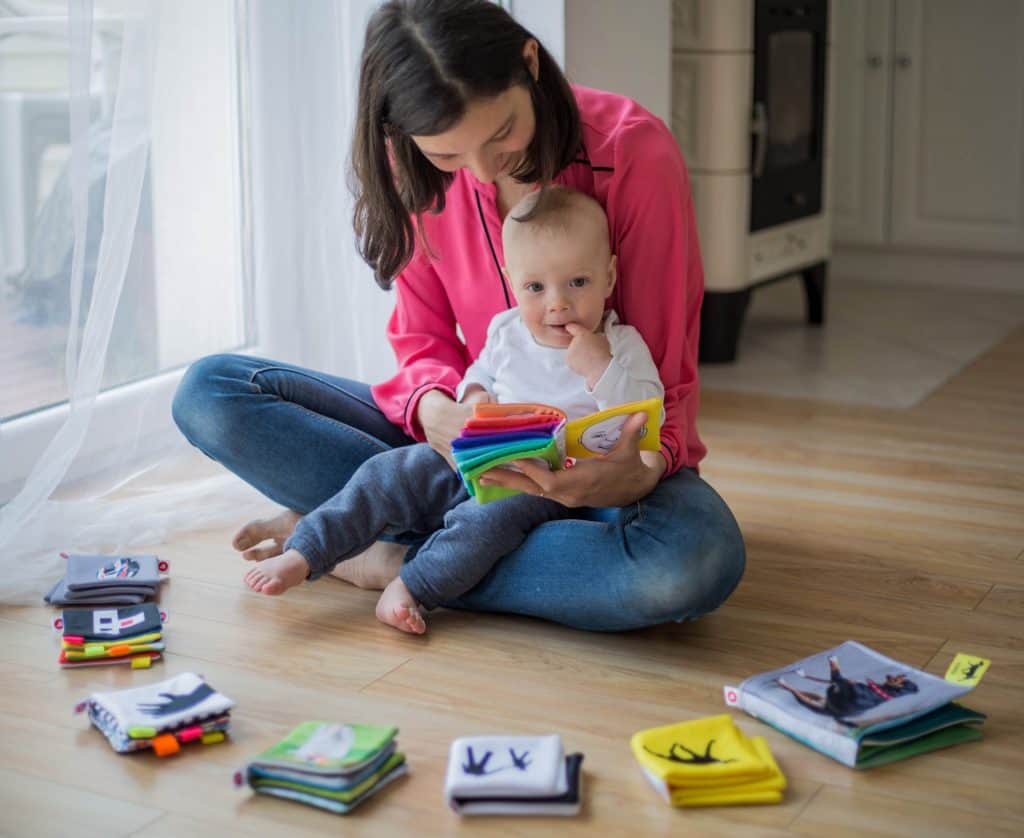 Mother Developing Friendship Skills by Reading to Baby